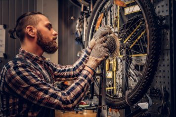 Person repairs bike in Dublin